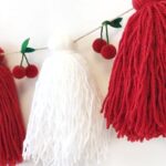 Foto alternativa 2 guirnalda tassel de lana cerezas